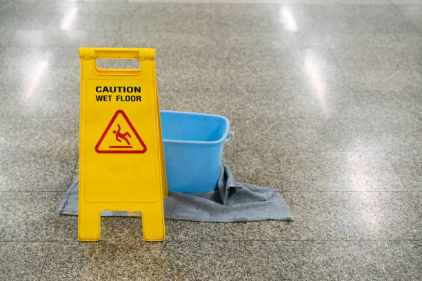 istock cleaning progress caution and wet floor sign in office, cleaning service concpet 1170066402