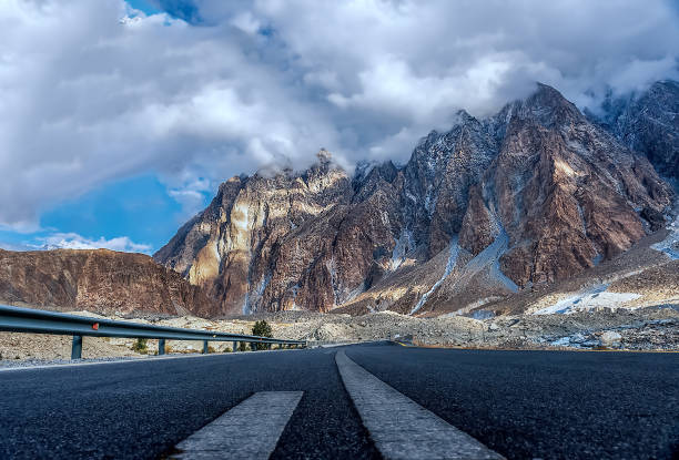 Karakoram highway and Passu rocks he Karakoram Highway is a 1,300-kilometre national highway which extends from Hasan Abdal in the Punjab province of Pakistan to the Khunjerab Pass in Gilgit-Baltistan, where it crosses into China and becomes China National Highway karakoram highway stock pictures, royalty-free photos & images