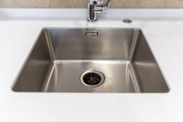 istock Stainless kitchen sink with food waste disposal in modern home 1170068741