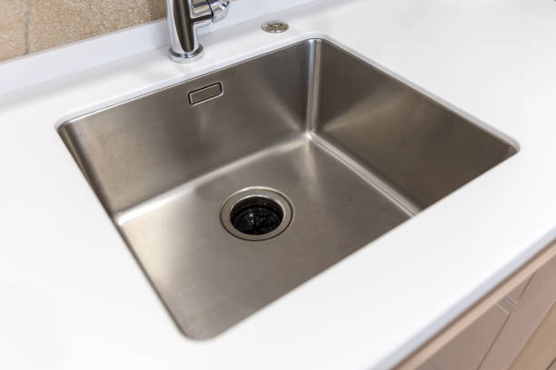 istock Stainless kitchen sink with food waste disposal in modern home 1170068847