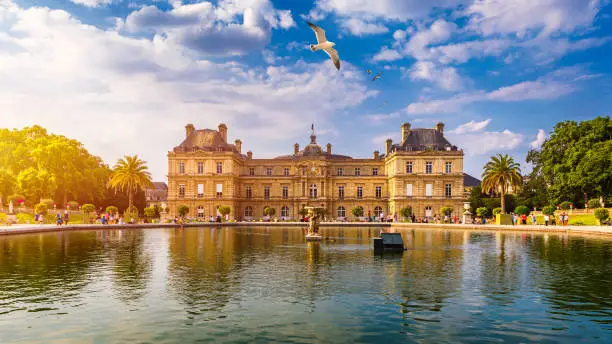 Photo of The Luxembourg Palace in The Jardin du Luxembourg or Luxembourg Gardens in Paris, France. Luxembourg Palace was originally built (1615-1645) to be the royal residence of the regent Marie de Medici.