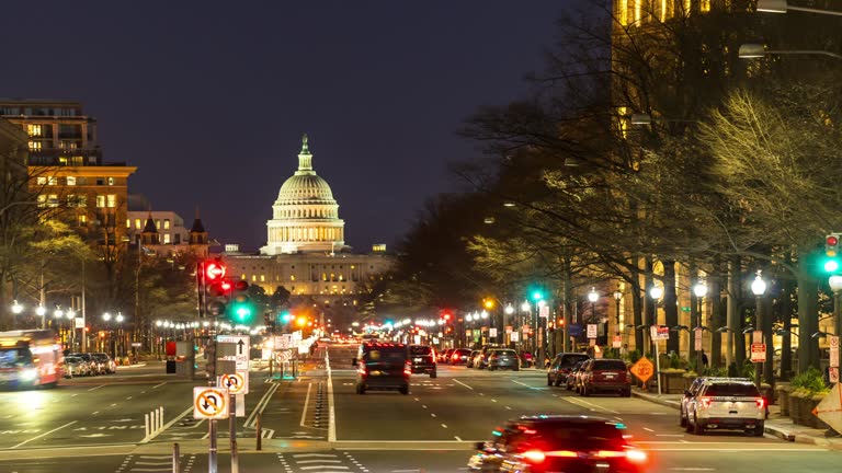 Time-lapse: US Capitol Building with transportation light from Freedom Square in Washington DC, USA at sunset twilight