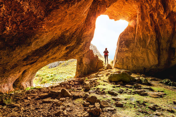 istock Female exploring vast caves in Australian Wilderness 1170073702
