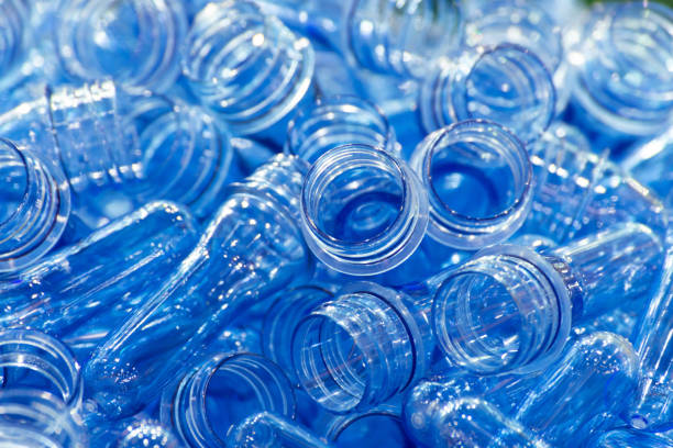 istock group of blue transparent plastic PET preforms is ready to produce for water drink packaging plastic bottle in the beverage industry. beverage industrial concept. selective focus. 1170073784
