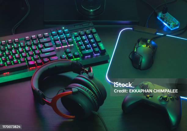 Gamer Work Space Concept Top View A Gaming Gear Mouse Keyboard Joystick Headset Mobile Joystick In Ear Headphone And Mouse Pad On Black Table Background Stock Photo - Download Image Now