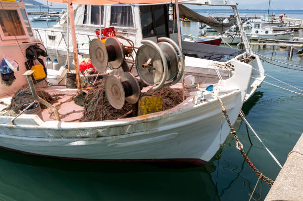 istock Fishing boat in a small seaport 1170076154