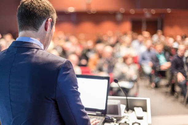 istock Public speaker giving talk at business event. 1170078802