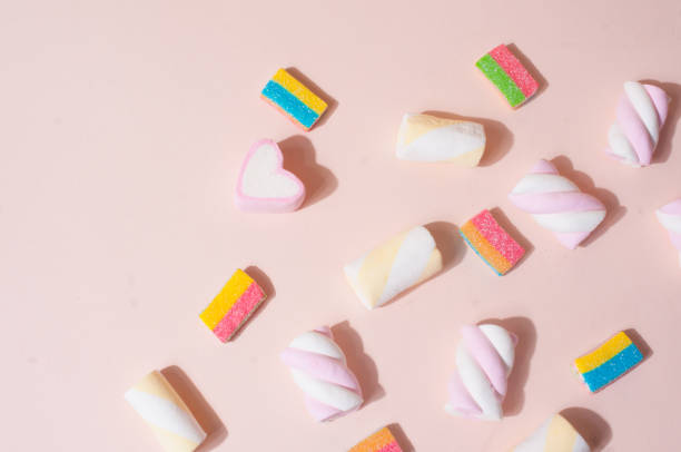 istock Colorful pink cute top view flat lay background with candies and marshmallow 1170078876