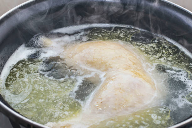 istock boiled chicken in a pot broth close-up with blurred background and front 1170079753