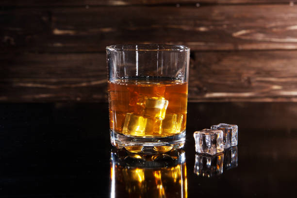 istock whiskey with ice on a wooden table 1170081016