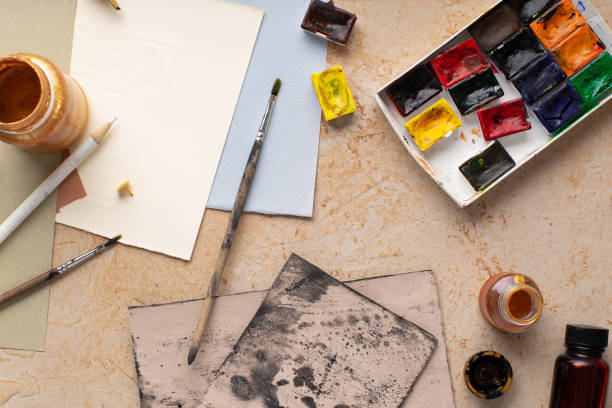istock Artist's workspace flatlay. Art equipment on rustic background. Overhead image. 1170081391