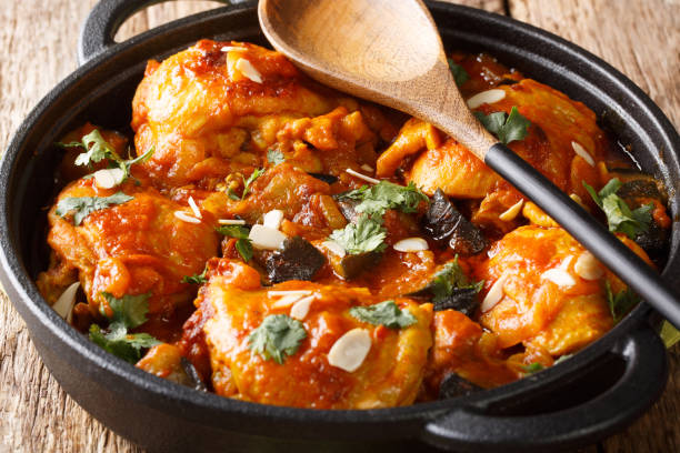 istock Moroccan Chicken with Eggplant, Tomatoes, and Almonds closeup on a plate. Horizontal 1170082614