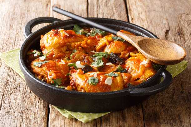 istock Moroccan recipe Chicken with eggplant, almonds with vegetable gravy close-up in a pan. Traditional summer food. 1170082882