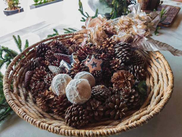 istock Decorative vase filled with cones. Christmas table decoration 1170083714