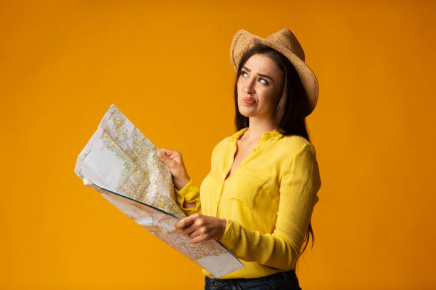 istock Bored Traveler Girl Holding Map Planning Next Trip, Studio Shot 1170086192