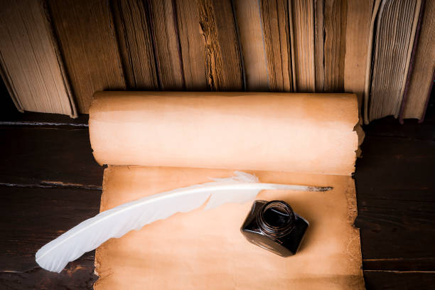 istock Scroll of papyrus, and a pen and inkwell 1170088084
