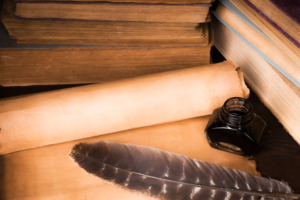 istock Scroll of papyrus, and a pen and inkwell 1170088135
