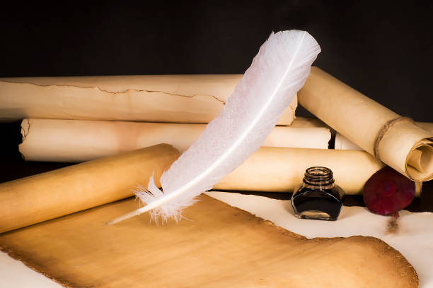 istock Scroll of papyrus, and a pen and inkwell 1170088158