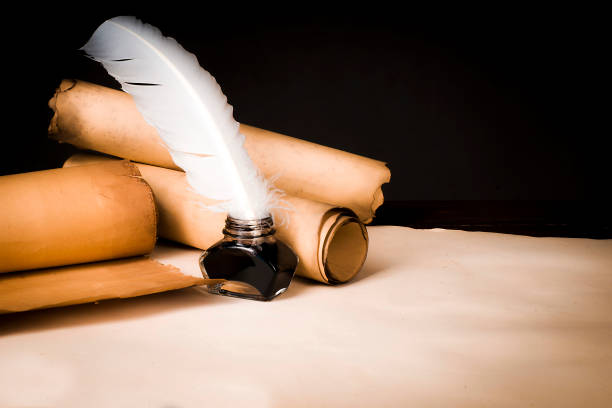 istock Scroll of papyrus, and a pen and inkwell 1170088233