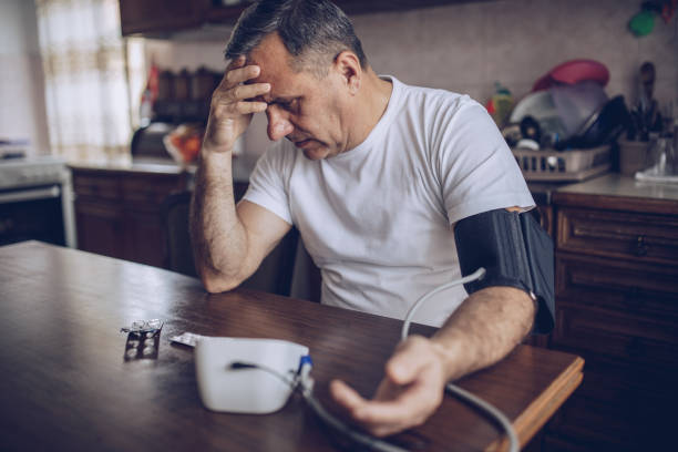 istock Senior man checking his blood pressure 1170089079