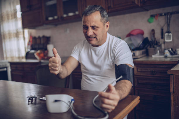 istock Senior man checking his blood pressure 1170089269
