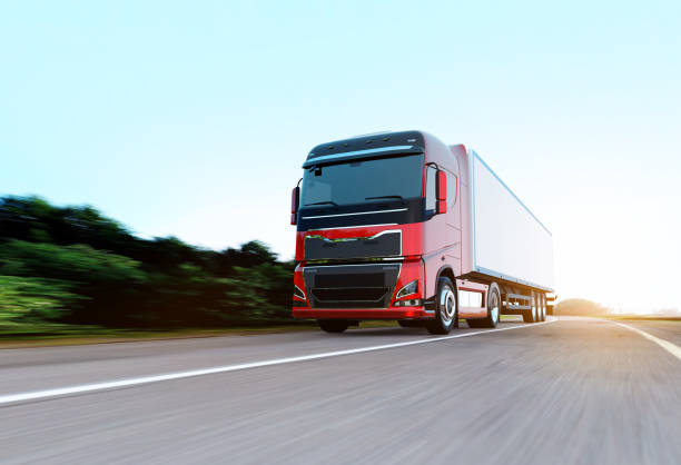 istock semi-truck with trailer driving on road 1170089610