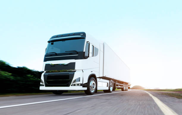 istock semi-truck with trailer driving on road 1170089613