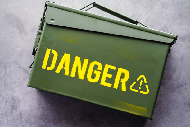 istock Green ammo box isolated on dark background 1170092554