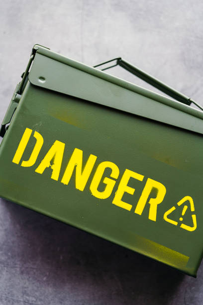 istock Green ammo box isolated on dark background 1170092589
