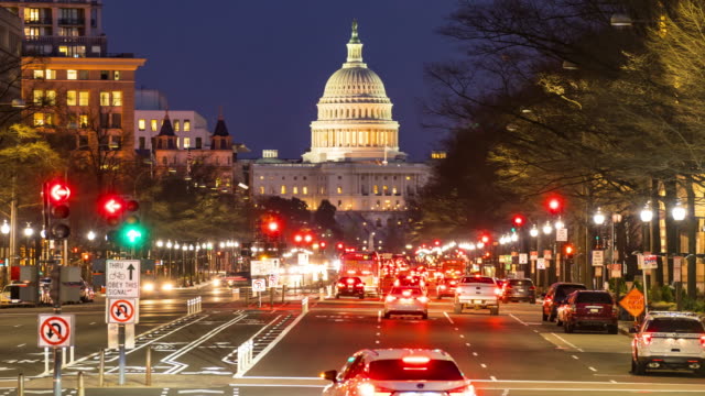 Time-lapse: US Capitol Building with transportation light from Freedom Square in Washington DC, USA at sunset twilight
