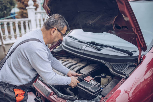 istock the mechanic repairs the car 1170096784
