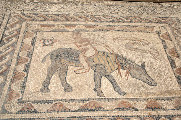 Man riding donkey backward mosaic in roman villa