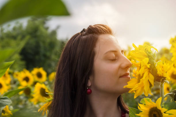 istock Young woman backlit by the warm glow of the sun 1170098708