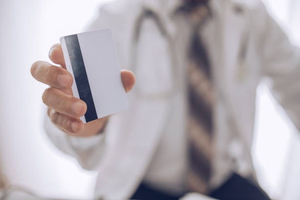 istock Doctor shows credit card 1170099528