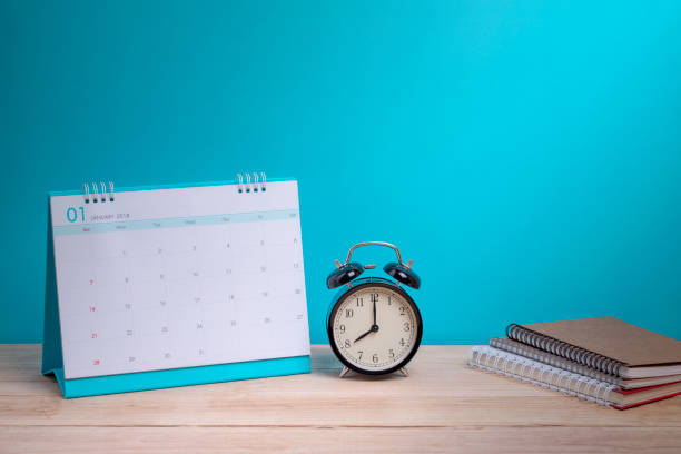 istock Vintage clock and calendar on wood, time concept 1170101161