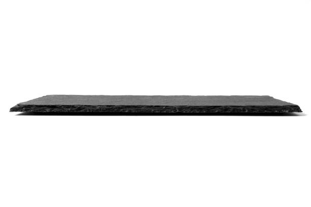 istock Black stone plate isolated on white background 1170101947