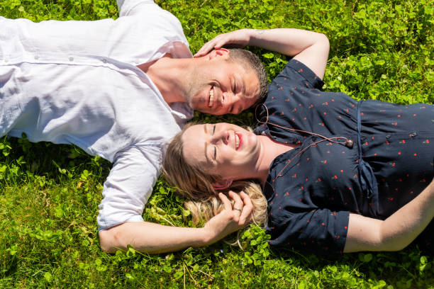 istock Funny and lovely couple in grass 1170101950