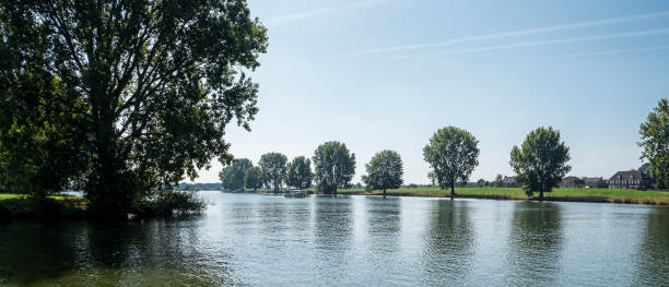 Boating on the Meuse at Mook stock photo