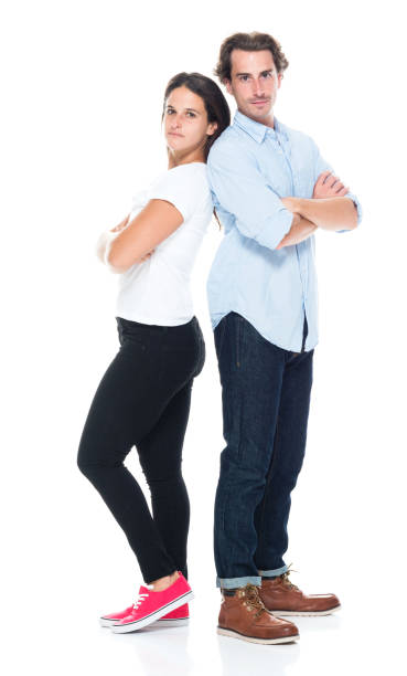 istock Attractive couple are standing back to back with arms crossed 1170104620