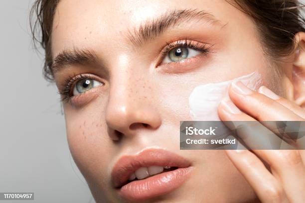 Young And Beautiful Skin Stock Photo - Download Image Now - Moisturizer, Women, Beauty
