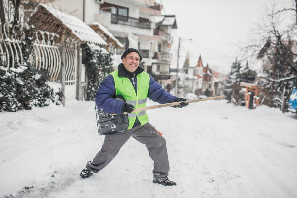 istock Man cleaning snow on the street 1170105961