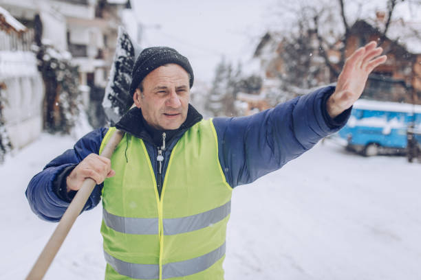 istock Man cleaning snow on the street 1170105965
