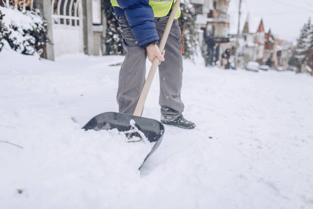istock Man cleaning snow on the street 1170106006