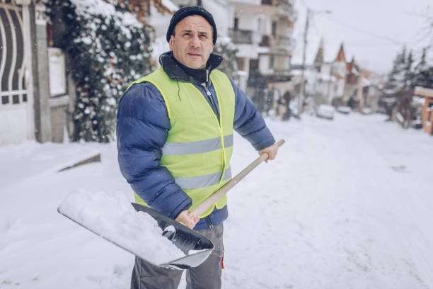 istock Man cleaning snow on the street 1170106023