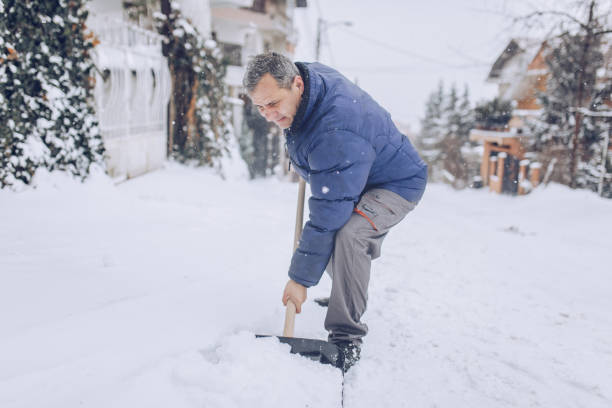 istock Man cleaning snow on the street 1170106026