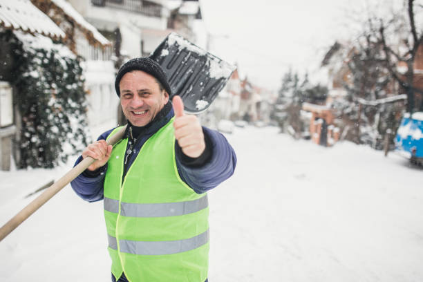 istock Man cleaning snow on the street 1170106030