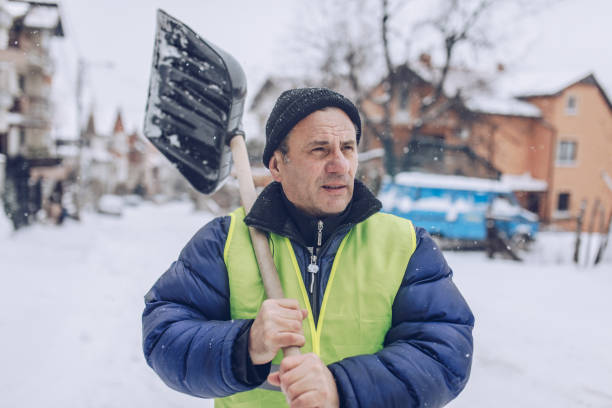 istock Man cleaning snow on the street 1170106031