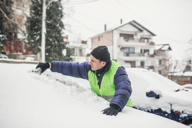 istock Man cleaning snow on the street 1170106033