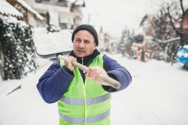 istock Man cleaning snow on the street 1170106107