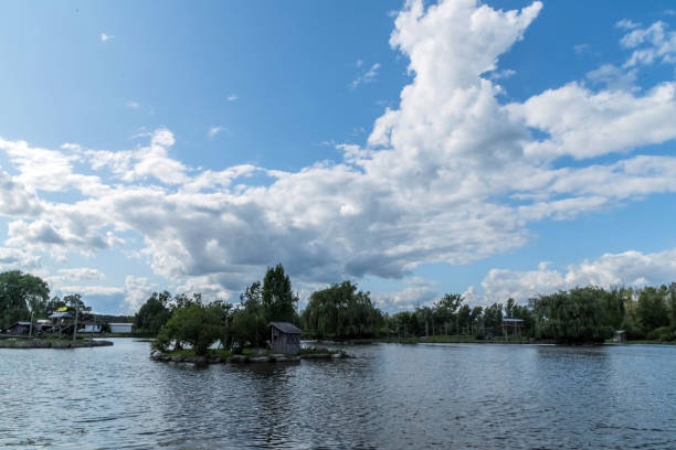 Beautiful Blue Sky Background With Dramatic Fluffy White Clouds over Lake in Hamilton, Ontario,  Canada